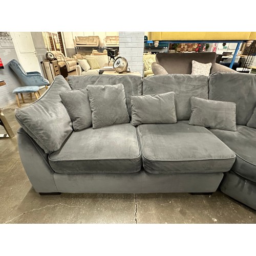 3107 - A steel velvet upholstered corner sofa