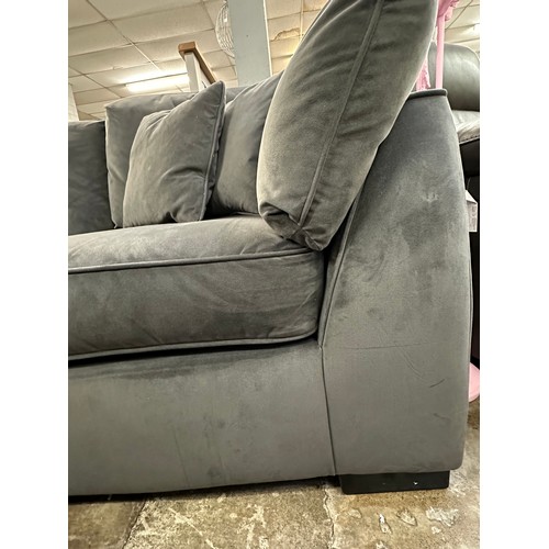 3107 - A steel velvet upholstered corner sofa