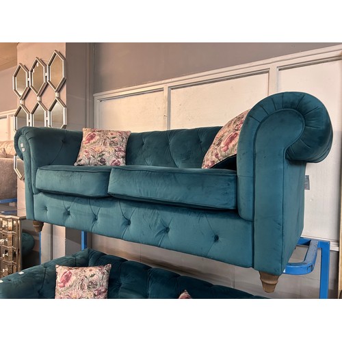 3019 - A turquoise Chesterfield three seater sofa