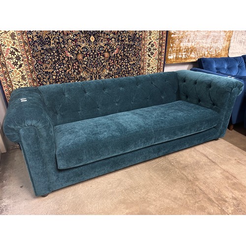 3034 - A Castleton green velvet three seater sofa