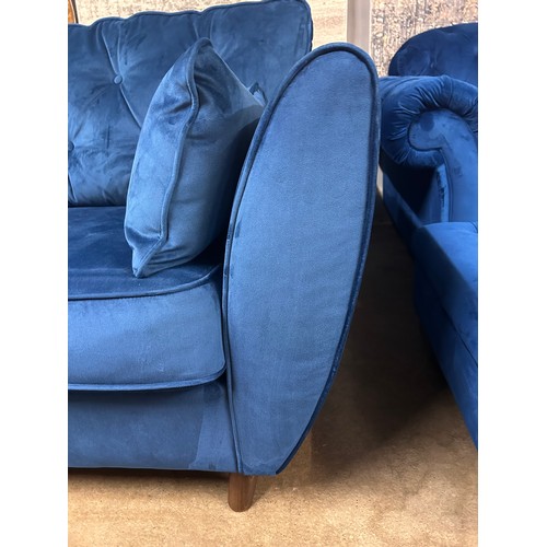 3037 - A Hoxton blue three seater sofa and footstool