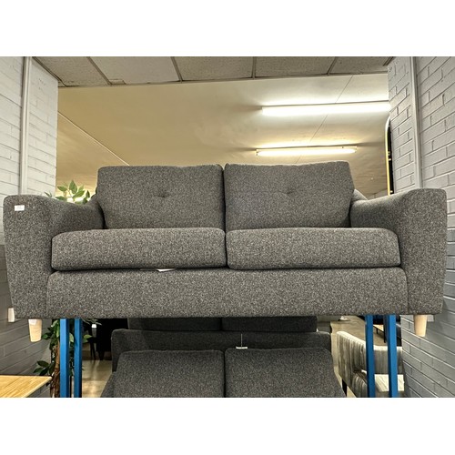 3114 - A dark static grey upholstered two seater sofa on turned oak legs