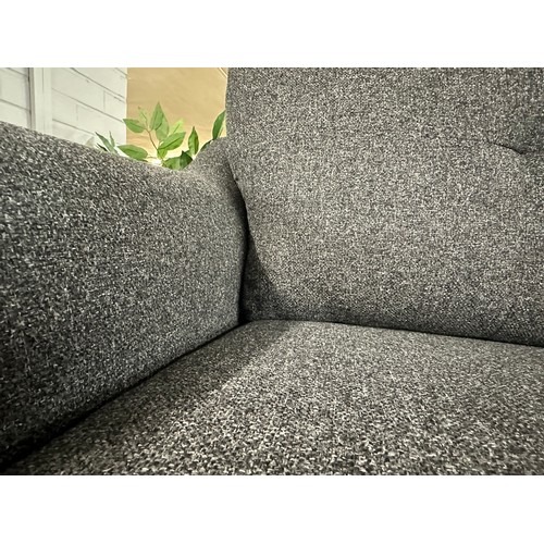 3114 - A dark static grey upholstered two seater sofa on turned oak legs