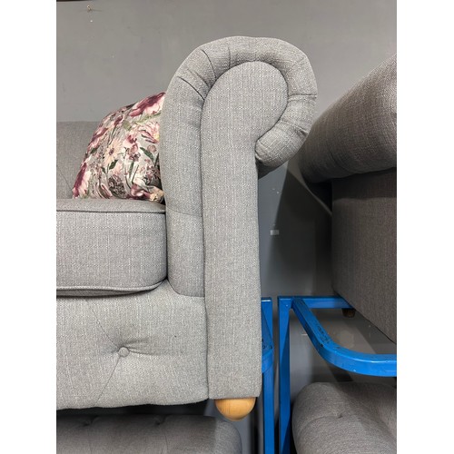 3043 - A grey upholstered Chesterfield three seater sofa