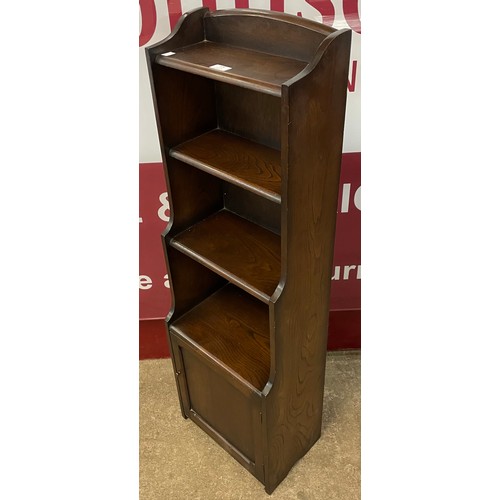 109 - An early 20th Century oak waterfall front open bookcase