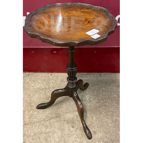 113 - An early 20th Century walnut tripod wine table