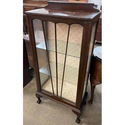 117 - An Art Deco mahogany single door display cabinet