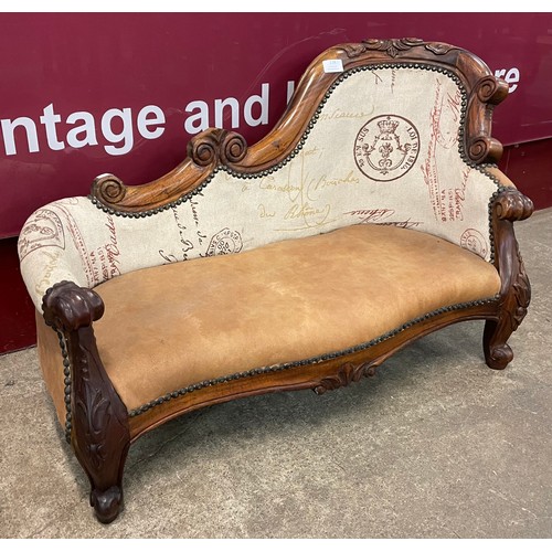 118 - A carved walnut, tan leather and fabric upholstered miniature chaise longue