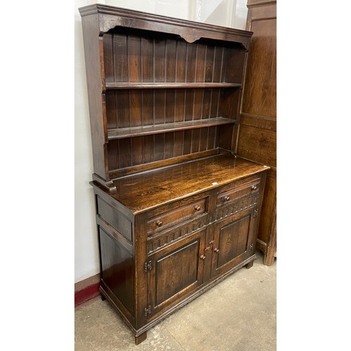 124 - A 17th Century style carved oak dresser