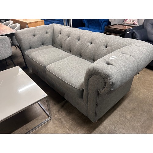 3052 - A dark grey weave Chesterfield three seater sofa