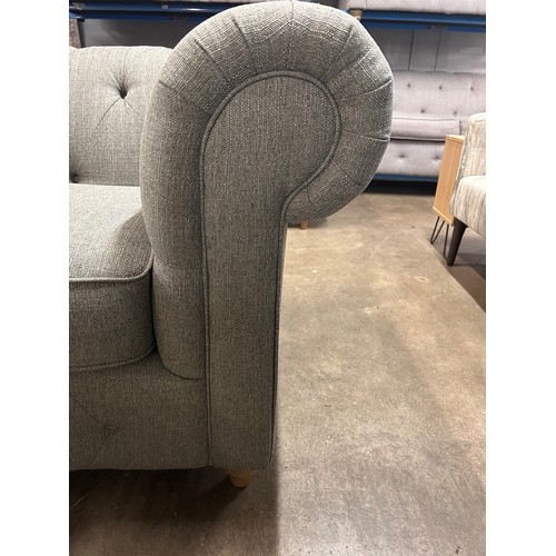 3052 - A dark grey weave Chesterfield three seater sofa