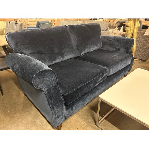 3055 - An ink blue velvet two seater sofa