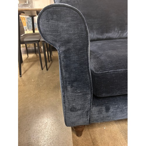 3055 - An ink blue velvet two seater sofa