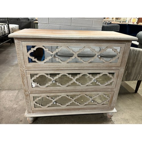 3117 - A three drawer mirrored front lattice chest