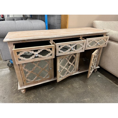 3118 - A 140cm wooden and mirrored front lattice sideboard