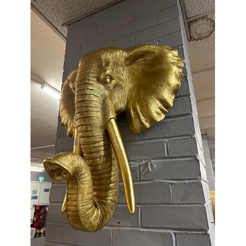 3067 - A large gold bust of an elephant