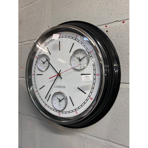 3072 - A black multi dial clock