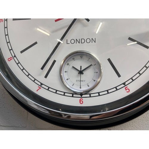 3072 - A black multi dial clock