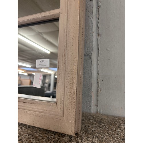 3090 - A large sixteen pane mirror