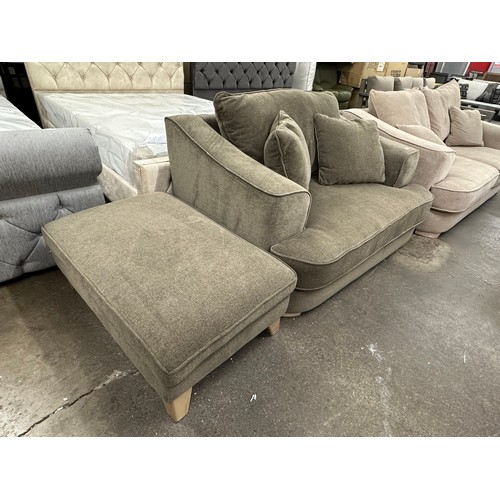 3145 - An olive green upholstered love seat and footstool on smoked oak legs