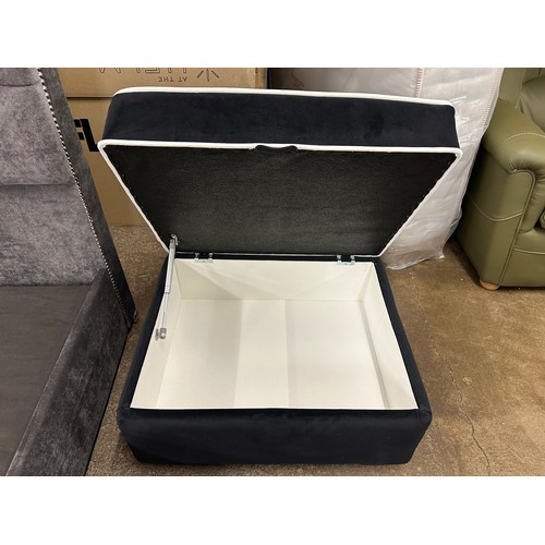 3152 - A black velvet upholstered ottoman footstool with white piping