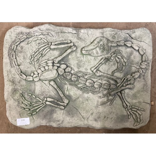 220 - A concrete garden plaque, depicting a fossil