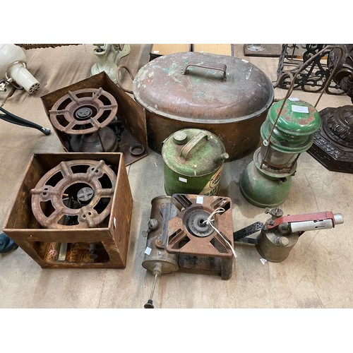 221 - Assorted oil lighters, furnaces, a copper pot, etc.