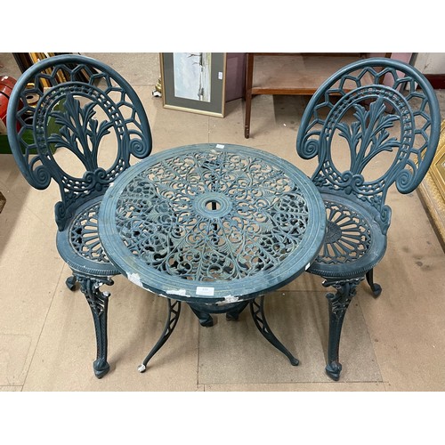 224 - A cast alloy garden table and two chairs