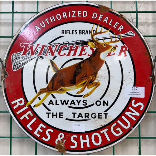 247 - A Winchester Rifles & Shotguns enamelled metal advertsing sign