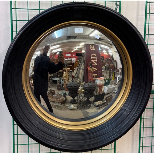 270 - A Regency style ebonised and parcel gilt framed convex mirror