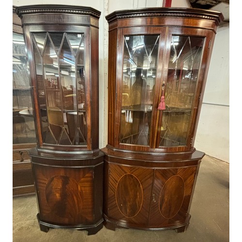 193A - Two George III style mahogany freestanding corner cabinets