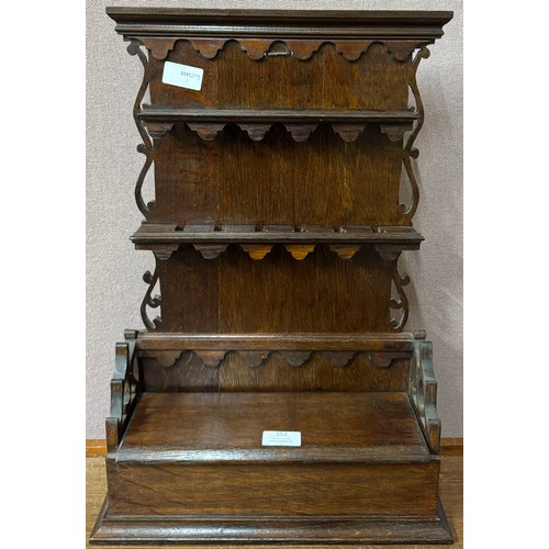 252 - A George III oak wall hanging spoon rack