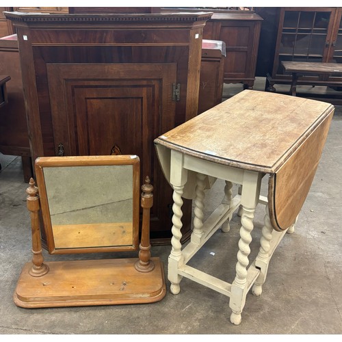 179 - A pine toilet mirror, a George III inlaid mahogany and oak corner cupboard and a oak barleytwist gat... 