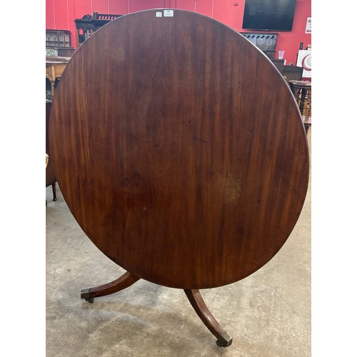 180 - A George III mahogany tilt top tripod breakfast table