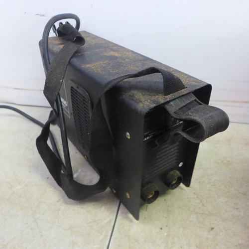 5013 - A Stamos 5-MMA-250P12 welder with mask and a quantity of rods