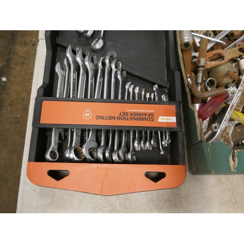 5018 - A large collection of assorted spanners, and other tools and a part complete combination metric span... 