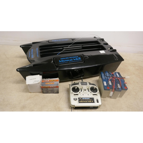 5053 - An Angling Technics Microcat MK2 remote control baiting boat with 4 batteries, charger and carry cas... 