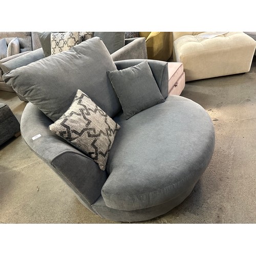 3205 - A charcoal upholstered swivel chair