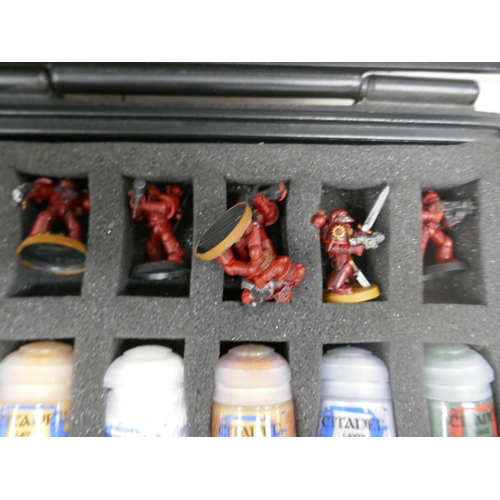 5074 - A quantity of Citadel miniature model paint and a quantity of miniature figures in a Citadel case