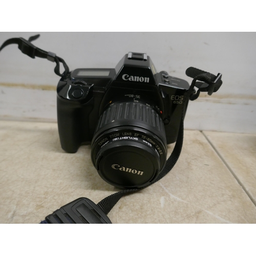 5075 - A Canon EO5 1000 film camera body, a Canon EO5 650 film camera body, a Canon EO5 650 with Canon zoom... 