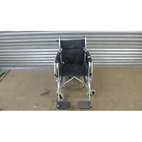 5128 - An Enigma folding wheelchair with footrests