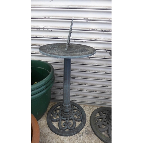 5149 - A large quantity of assorted garden items including plastic buckets, a cast iron effect sun dial, a ... 