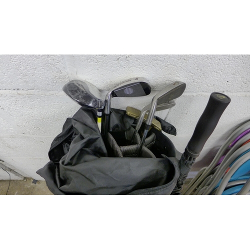 5177 - A Dunlop golf bag with umbrella, putter, driver and 3 other clubs