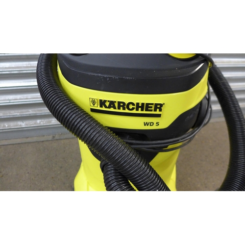 5221 - A Karcher WD5 electric wet and dry vac with hose and brush attachment