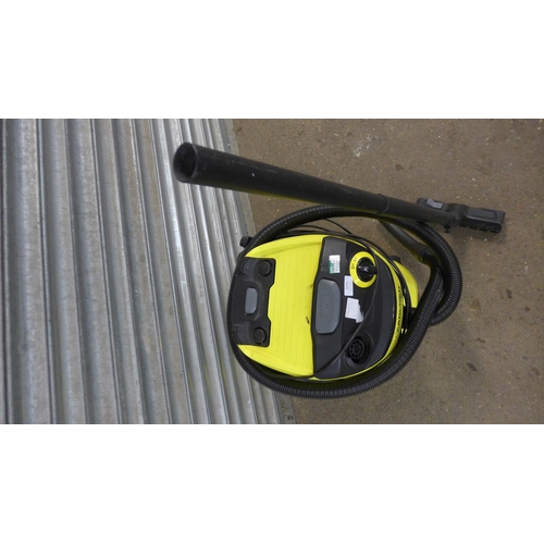 5221 - A Karcher WD5 electric wet and dry vac with hose and brush attachment