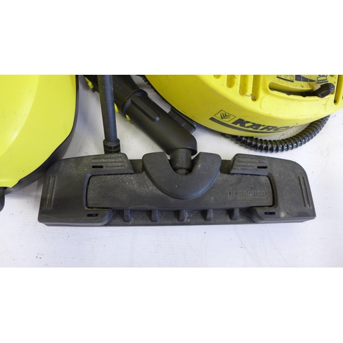 5275 - A Karcher SC3 steam cleaner with brush, lance and patio cleaner attachments