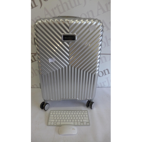 5281 - A Juicy Couture silver four wheeled suitcase and a wireless keyboard and mouse