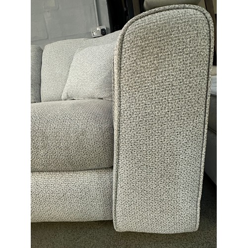 3211 - An ivory textured weave upholstered two seater sofa