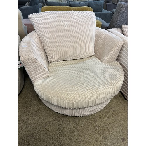 3219 - An ivory jumbo chord upholstered swivel chair