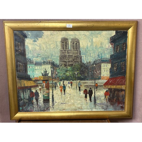 303 - A Parisian street scene, oil on canvas, framed